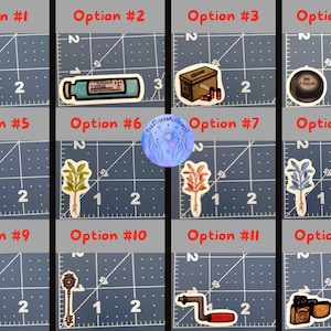 May include: A collection of twelve sticker designs on a grid background. The stickers feature various images, including a red and white umbrella logo, a vial labeled "T-VIRUS", a first aid kit, an ink ribbon, a plant, a key, a knife, a camera, and a spray bottle.