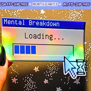 May include: A holographic sticker with a blue and white computer screen design. The screen says "Mental Breakdown" and "Loading..." with a progress bar that is almost full. A cursor with an hourglass is in the bottom right corner.