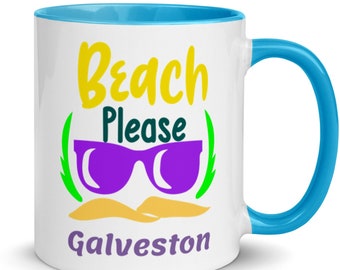 May include: White ceramic mug with a light blue rim and handle. The mug has a graphic design that says "Beach Please Galveston" with a pair of purple sunglasses and a yellow beach scene.
