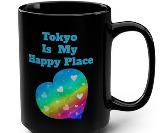 May include: Black ceramic coffee mug with a rainbow heart and the text "Tokyo is My Happy Place" in blue.