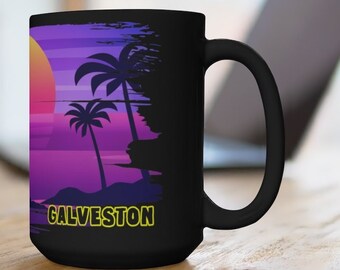 May include: Black ceramic mug with a sunset scene and palm trees. The text "GALVESTON" is printed in yellow on the mug.