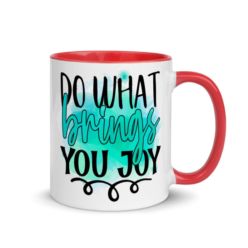 May include: White ceramic mug with a red rim and handle. The mug features a teal watercolor design with the text "Do what brings you joy" in black.