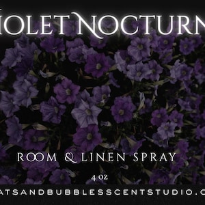 May include: A black label for a 4 oz room and linen spray titled Violet Nocturne. The label features a central image of purple flowers, white text including caution warnings, instructions to shake gently, and the website batsandbubblesscentstudio.com.