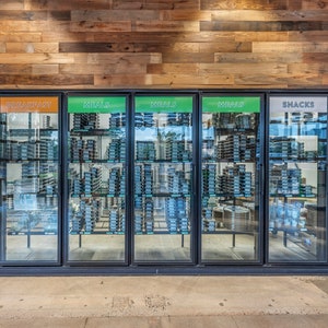 May include: Six glass-door refrigerators with black frames, labeled "Breakfast", "Meals", "Snacks", and "Drinks". The refrigerators are filled with various food and beverage items.