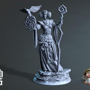 May include: A gray painted miniature figurine of a female wizard holding a staff and a bird. The wizard is wearing a long robe and has a staff with a spiral design. The figurine is standing on a gray rock base.
