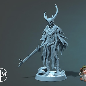 May include: A light blue figurine of a character with a horned helmet, flowing cape, and a sword. The figure stands on a circular base. A small cartoon monkey with headphones is to the right of the figure.