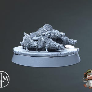 May include: A group of gray, sculpted rats are piled on top of each other on a round, gray base. The rats are in a fighting pose with their teeth bared.