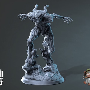 May include: A grey, detailed, resin sculpture of a demon with horns and claws, standing on a rocky base. The demon is posed in a dynamic, leaping stance.