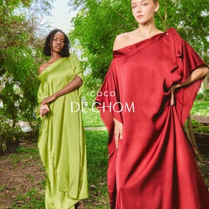 Handmade blue kaftan maxi dress with off shoulder styling, loose flowy fit, and self-tie bow detail, perfect for resort wear or a beach wedding guest outfit.