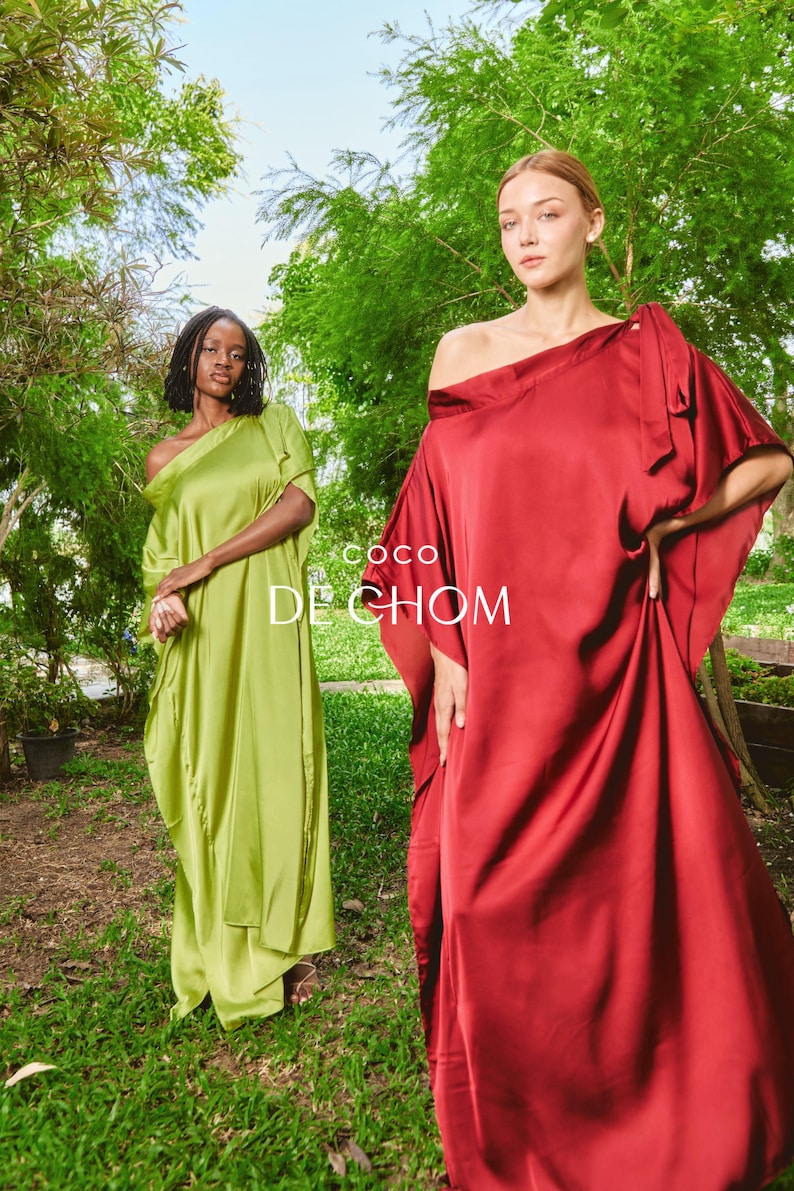 Handmade blue kaftan maxi dress with off shoulder styling, loose flowy fit, and self-tie bow detail, perfect for resort wear or a beach wedding guest outfit.