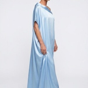 Handmade blue kaftan maxi dress with off shoulder styling, loose flowy fit, and self-tie bow detail, perfect for resort wear or a beach wedding guest outfit.