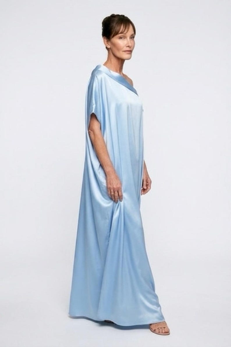 Handmade blue kaftan maxi dress with off shoulder styling, loose flowy fit, and self-tie bow detail, perfect for resort wear or a beach wedding guest outfit.