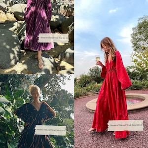A red maxi kaftan dress with a V-neckline and long sleeves. The dress has a cinched waist and a flowing skirt.