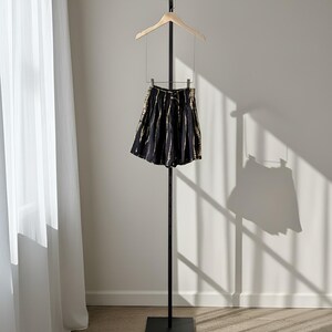 Black and white tie-dye shorts with a drawstring waist.