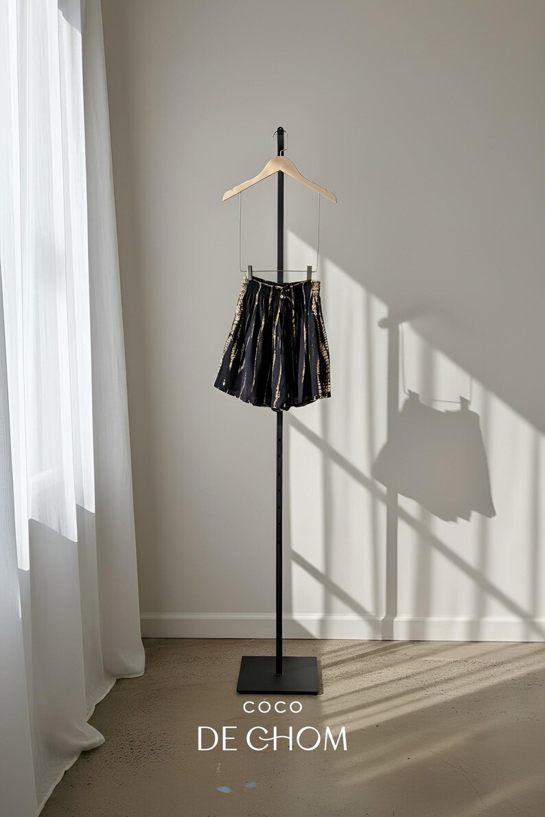 Black and white tie-dye shorts with a drawstring waist.