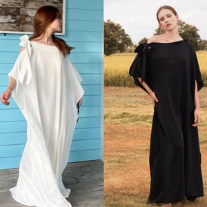 Handmade blue kaftan maxi dress with off shoulder styling, loose flowy fit, and self-tie bow detail, perfect for resort wear or a beach wedding guest outfit.