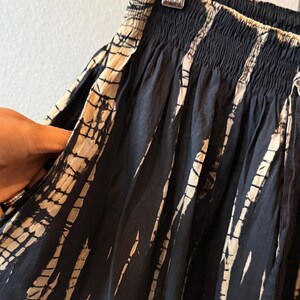 Black and white tie-dye shorts with a drawstring waist.