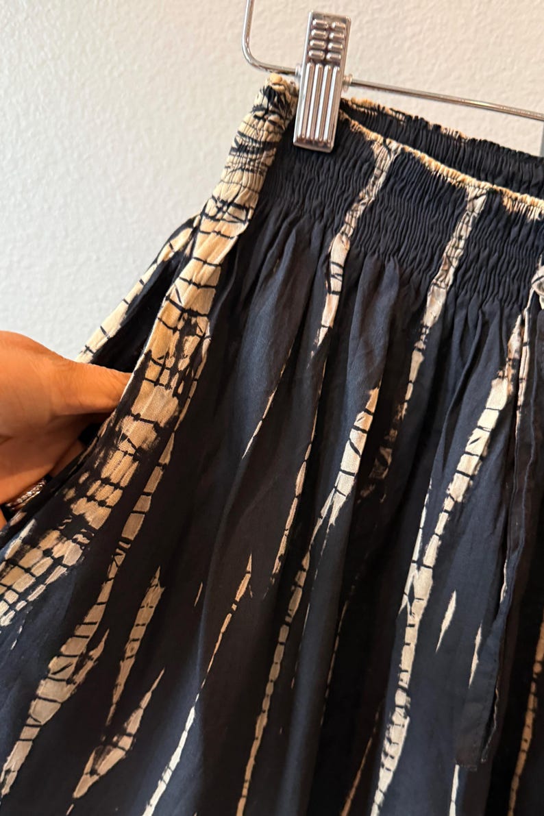 Black and white tie-dye shorts with a drawstring waist.