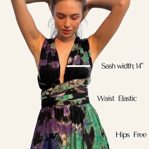 Infinity Tie Dye Mini Dress by COCO DE CHOM® – handmade bohemian summer dress with open back halter neckline, side pockets, and elastic waist. Lightweight resort wear perfect for beach vacations, festivals, honeymoons, or pool parties. Ethically made from 100% soft rayon with a one-of-a-kind hand-dyed pattern. Flowy, breathable, and designed for S/M/L body types.