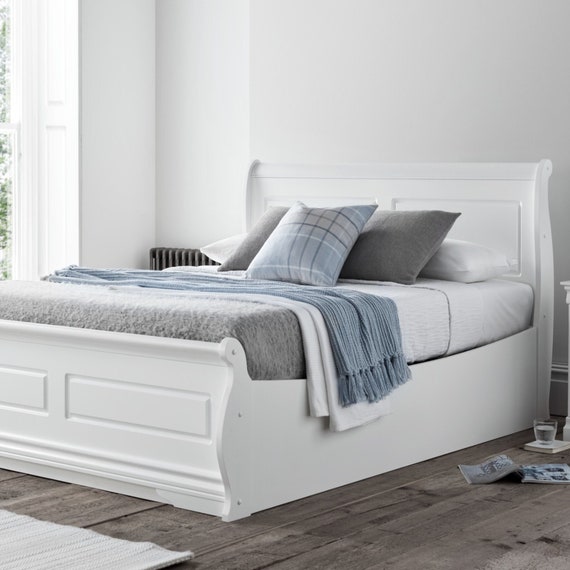 Wooden sleigh 2024 ottoman bed