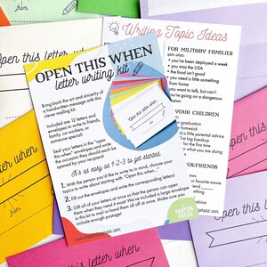 May include: A blue and pink card with the text "Open This When" and a pencil icon. The card is part of a letter writing kit with 12 letters and envelopes for writing to friends, family, co-workers, or someone special. The card includes instructions on how to use the kit and suggests topics for writing.