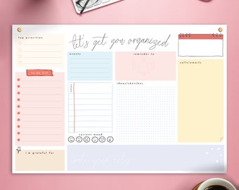 May include: A printable planner with sections for top priorities, events, reminders, calls/emails, to-do list, ideas/sketches, current mood, and notes. The planner has a light pink, light blue, and yellow color scheme with a handwritten font.