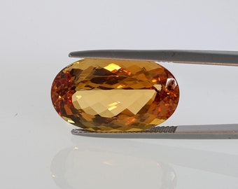 24.36 Cts Imperial Topaz, Oval Shape, Golden Peachy Orange with Reddish Hue