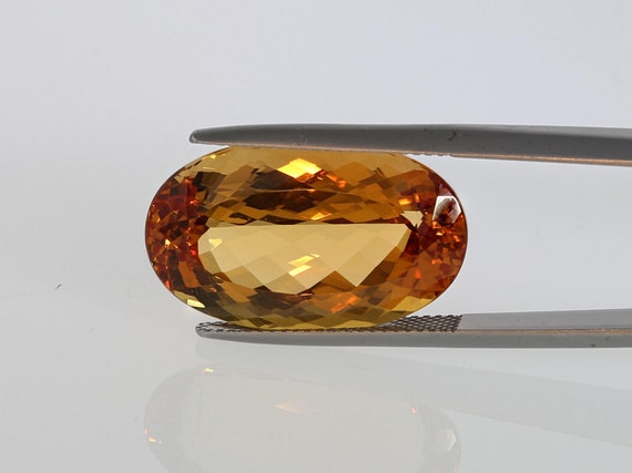 24.36 Cts Imperial Topaz, Oval Shape, Golden Peachy Orange With