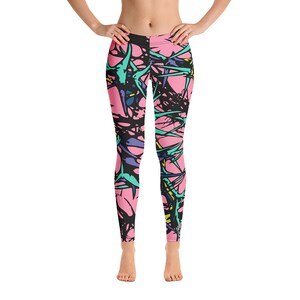 Puede incluir: Leggings rosas con un patr&oacute;n abstracto de espinas en negro, azul, verde y amarillo.