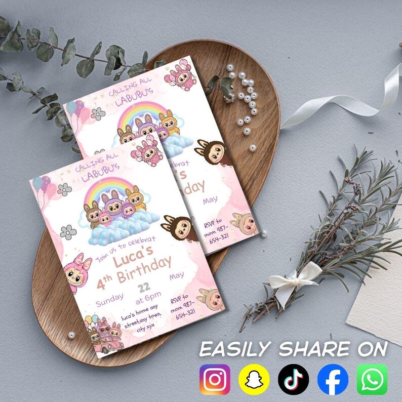 May include: Two pink birthday invitations featuring cartoon characters, rainbows, and the text "CALLING ALL LABUBU'S". The invitations read "Luca's 4th Birthday" with date, time, and RSVP details. The invitations are on a wooden tray with decorative elements.