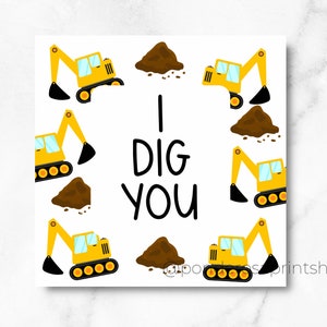 May include: Square card with a white background featuring yellow cartoon excavators and brown piles of dirt. The text "I DIG YOU" is in black, centered on the card. The excavators surround the text, creating a playful design.