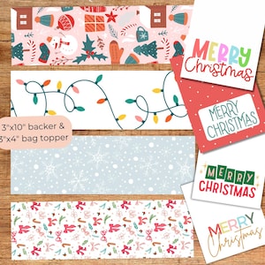 Puede incluir: Adornos y tarjetas navideñas. Los adornos presentan patrones festivos con motivos navideños, incluyendo luces, copos de nieve y bastones de caramelo. Las tarjetas muestran "Merry Christmas" en varias fuentes coloridas. Las dimensiones son 7,6cm x 25,4cm y 7,6cm x 10,2cm.