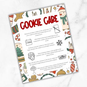 May include: A festive, illustrated Cookie Care guide with the title in red. The guide provides instructions for storing cookies, including not refrigerating them and freezing them in airtight containers. Decorative holiday elements surround the text.