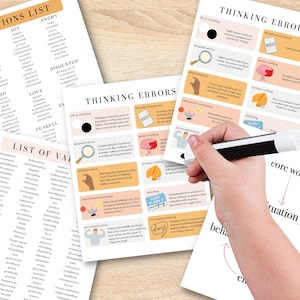 May include: A collection of printed worksheets with lists of emotions, values, and thinking errors. The worksheets are white with black text and colorful illustrations. A hand holds a pen, pointing to the "Thinking Errors" sheet.