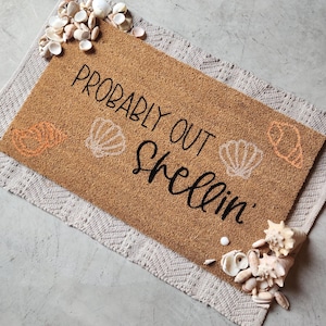 probably out shellin, looking for shells, seashell doormat, beach doormat, beach airbnb doormat, coastal doormat
