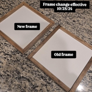 May include: Two square wooden framed signs with white centers. One sign is labeled "New frame" and the other "Old frame." The text "Frame change effective 10/25/24" is at the top. The frames are a light brown color.