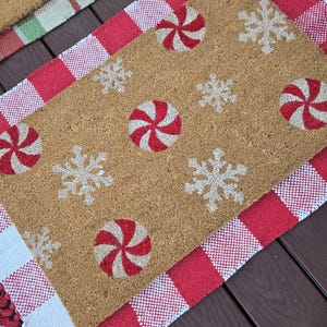 peppermint snowflake white christmas doormat, candy cane lane doormat, christmas candy doormat, red and white doormat, festive christmas mat