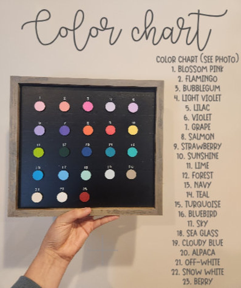 May include: Color chart with 23 different paint colors displayed in a framed board. The colors are labeled with numbers and names, such as Blossom Pink, Flamingo, Bubblegum, Light Violet, Lilac, Violet, Grape, Salmon, Strawberry, Sunshine, Lime, Forest, Navy, Teal, Turquoise, Bluebird, Sky, Sea Glass, Cloudy Blue, Alpaca, Off-White, Snow White, and Berry.