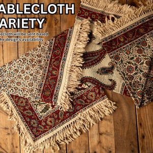 May include: Tablecloths with intricate floral and paisley patterns in red, cream, and green. The edges of the tablecloths have a fringed trim. The image includes the text "TABLECLOTH VARIETY".