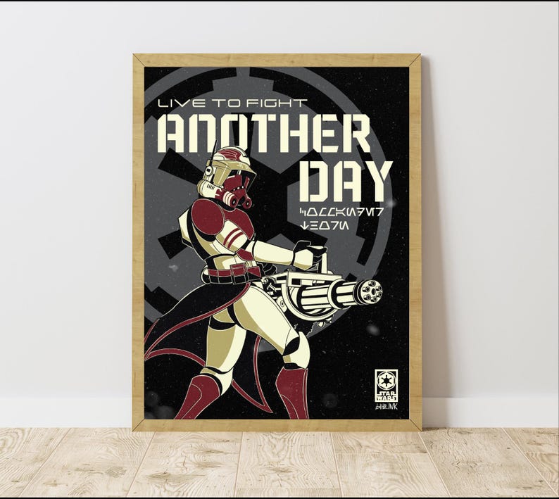 May include: Framed poster of a Star Wars clone trooper in red and white armour, holding a large weapon. The poster reads "LIVE TO FIGHT ANOTHER DAY" in white, with the Star Wars logo.