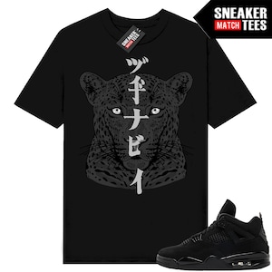 May include: Black t-shirt featuring a detailed grayscale leopard face design with Japanese characters. The shirt has a Sneaker Match Tees tag. A black sneaker is shown in the lower right corner.