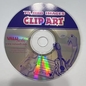 Puede incluir: Un CD-ROM con el texto "75.000 IMÁGENES CLIP ART" en un diseño azul y plateado. El disco presenta ilustraciones de un golfista, una guitarra y un portátil. También son visibles el logotipo y la dirección del sitio web de ValuSoft.