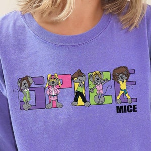 May include: A purple t-shirt with a graphic of five cartoon mice wearing colorful outfits and the text "Spice Mice".