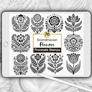 May include: A digital tablet screen displaying a collection of 70 black and white floral illustrations arranged in a grid. The central text box reads 70 Scandinavian flowers Procreate Stamps. A white stylus rests diagonally across the bottom.