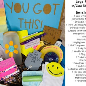 May include: A gift box with study supplies, including a glass with a flower design, highlighters, sticky notes, and a stress ball. The box has the words "YOU GOT THIS!" on the lid.