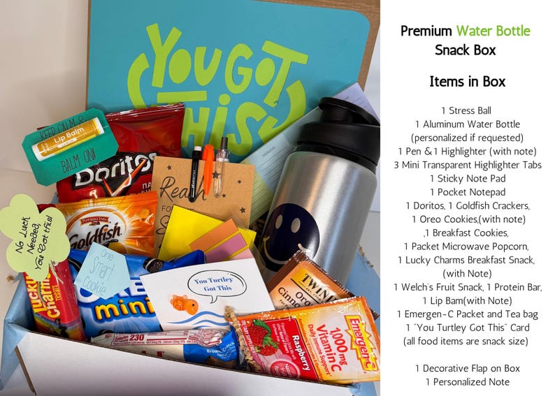 May include: A gift box filled with snacks, a water bottle, and stationery. The box includes chips, cookies, a stress ball, a water bottle with a smiley face, pens, highlighters, and a card that says "You Got This".
