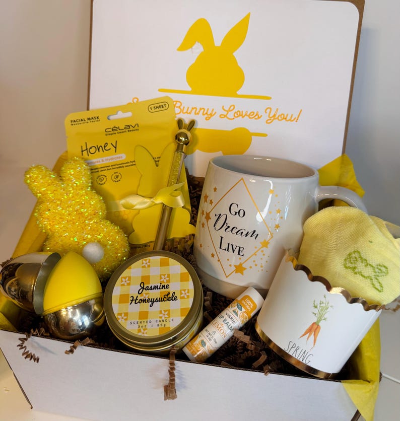 Perfect Handcrafted College Student Easter Gift Box. Filled with some items to pamper your student or loved one. Ceramic Mug, Face Mask, bunny socks, lip balm and plastic eggs filled with hair clips and facial sponge.