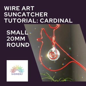 May include: A red wire art cardinal suncatcher with a small, 20mm round crystal. The image includes text that reads "Wire Art Suncatcher Tutorial: Cardinal" and "Shimmerly". The suncatcher is a decorative item.
