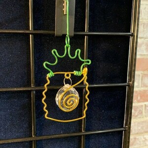Wire art prism pendant for home, office or rear-view mirror features crystal prism orb & guaranteed rainbows when placed in direct sunlight!