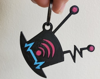 May include: A black 3D printed keychain shaped like a robot with a top hat, antenna, and a wifi symbol. The robot has pink and blue accents.